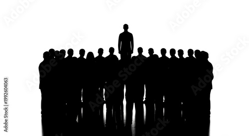 Silhouette of a leader standing out from a crowd of people.