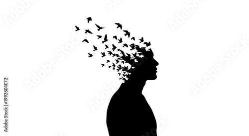 Silhouette of a person with birds flying out of head.