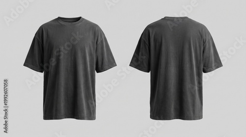 Front and back view of a blank charcoal black oversized t-shirt mockup with a vintage washed texture, isolated on a light grey background.