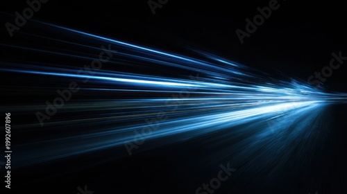 Abstract light trails in motion against a dark background