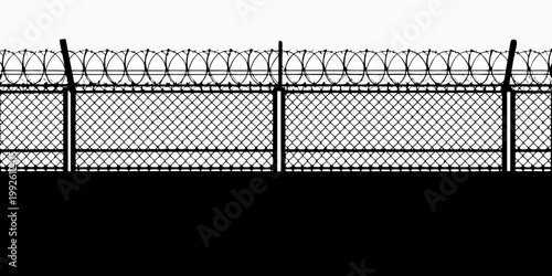 A stark black and white image of a barbed wire fence