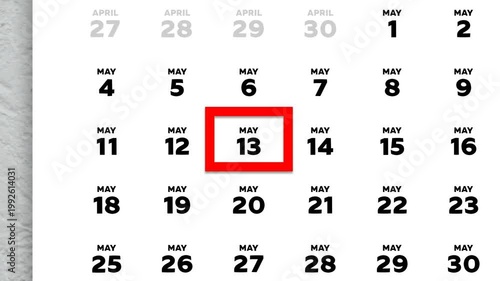 The date May 13th marked with a red cursor on the wall calendar 2026