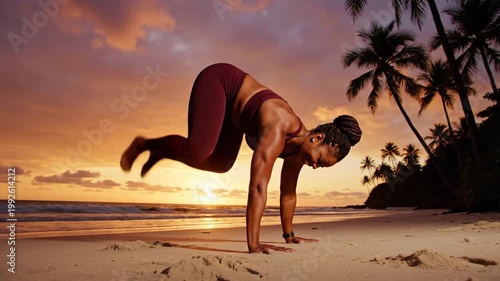 Woman doing yoga on beach at sunset