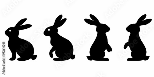 Four black silhouettes of rabbits in various upright poses