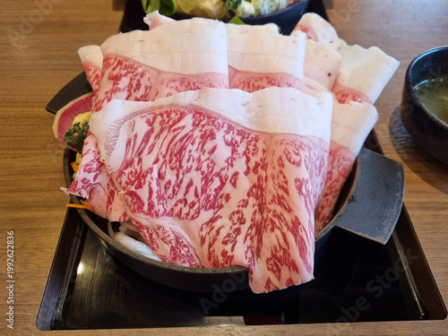 Фотография Japan Beef sukiyaki on hot pot dish