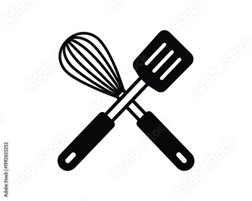 Black whisk and spatula cooking utensils crossed for kitchen and baking design.