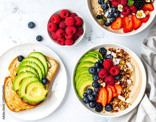 A delicious and healthy breakfast spread featuring avocado toast and fruit bowls