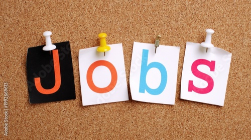 The word Jobs spelled out with letters pinned to a corkboard