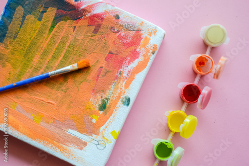 Watercolor paints and brushes. Abstract Oil Painting with Vibrant Orange and Red Brushstrokes on Textured Canvas – Modern Artistic Background for Creative Design