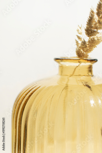 Amber glass vase with dried grass minimal home decor scene neutral interior styling modern aesthetic wall art print poster mockup branding template cozy lifestyle composition