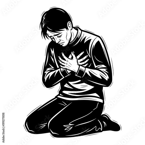 Young man in distress holding chest while sitting on floor in emotional pain or heartache