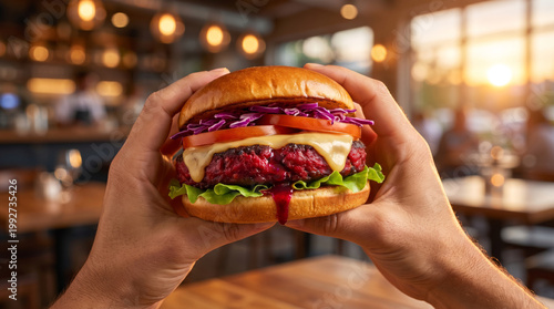 Plant-Based Vegan Burger with Beet “Bleeding” Patty Held in Hands, Gourmet Healthy Food Concept