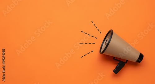 A megaphone on an orange background with dotted lines indicating sound