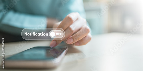 Konstfotografi User turning off notifications on smartphone with digital interface, representing focus mode, do not disturb settings, and personal control over alerts in modern mobile lifestyle