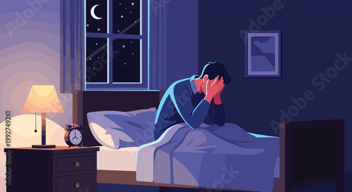 Sad and lonely man sitting on the edge of his bed at night suffering from insomnia, depression, or emotional distress in a dark bedroom.