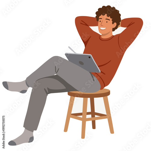 Man sitting on stool with laptop on lap smiling relaxed