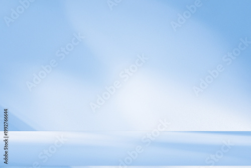 Wall interior background, studio and backdrops show products.with shadow from window color white and blue background for text insertion and presentation product	
