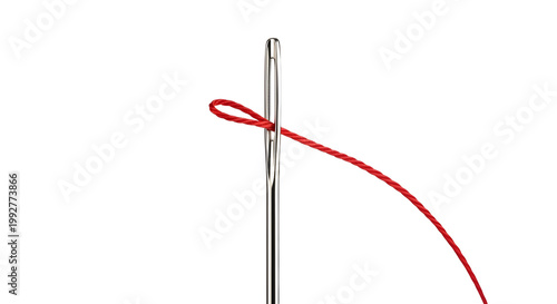 Close-up of a sewing needle with a looped red thread for stitching