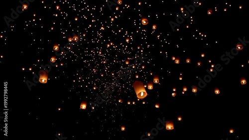 Enchanting Sky Lanterns at Yi Peng Festival, thousands of floating fire paper lanterns in the night sky Chiang Mai Province, Northern Thailand, Asia.