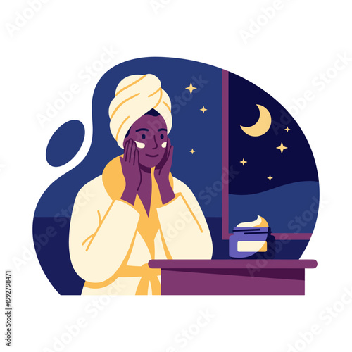 Woman applying night cream in cozy bathrobe with towel turban