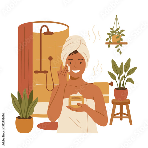 Woman applying face cream after shower in a modern bathroom