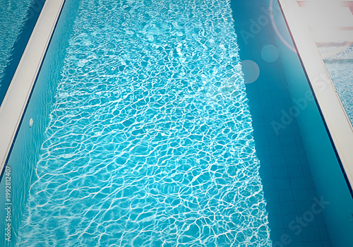 Serene minimalist clear blue swimming pool water with gentle sunlight reflection on surface