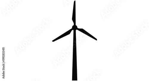 A solitary wind turbine stands against a bright plain background silhouette