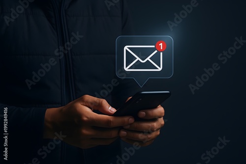 Person holding a smartphone with a notification icon indicating one unread message or email on the screen.