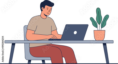 Man sitting at a desk working on laptop with plant nearby indoors