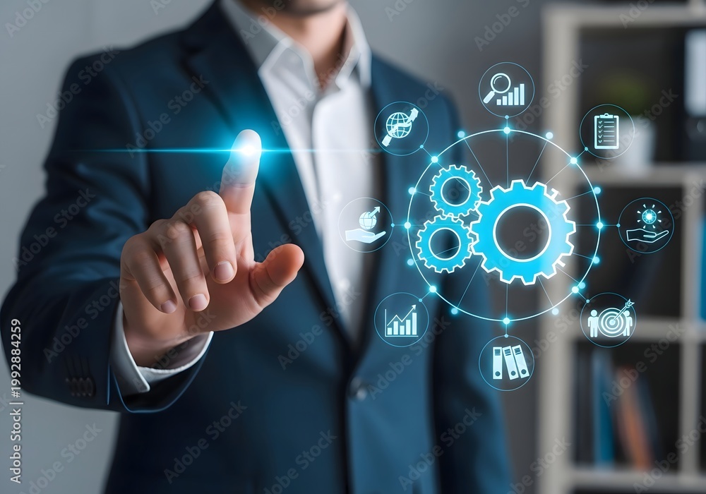 Obraz premium Businessman in a blue suit interacting with a futuristic digital interface in an office setting.