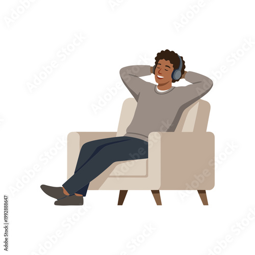 A man sitting comfortably in a chair listening to music with a relaxed expression