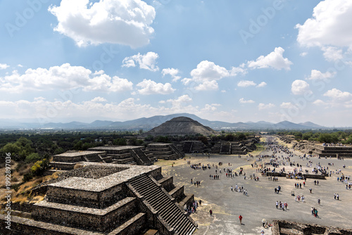 Visitors walk along the Avenue of the Dead near the Pyramid of the Sun at Teotihuacan