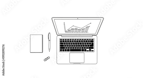Top view of a laptop with a graph on screen, notebook and pen on white background