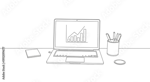 Laptop displaying growth chart, desk with pens and notepad, business growth concept