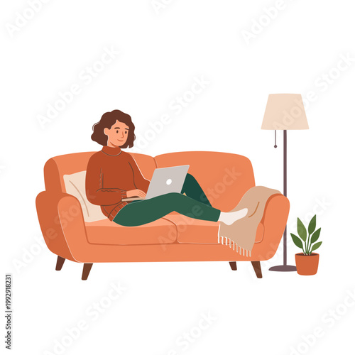Woman relaxes on couch with laptop beside lamp and plant indoors
