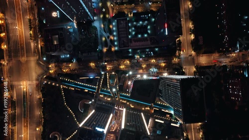 time lapse of traffic in modern city at night, aerial view