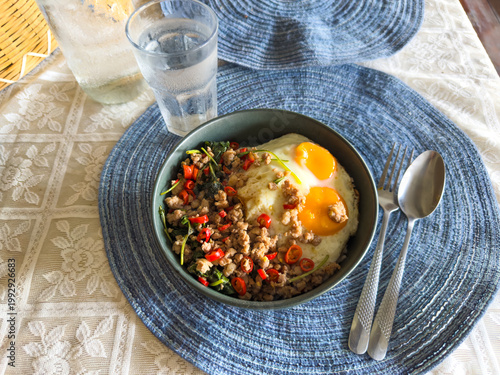 Bilde på lerret Authentic Thai food, spicy stir-fried minced pork with holy basil (Pad Kra Pao) topped with double fried eggs on rice