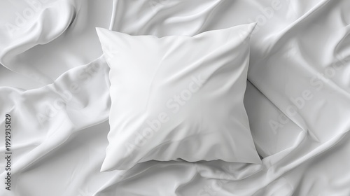 A neatly arranged white pillow on a crumpled bed sheet with smooth fabric