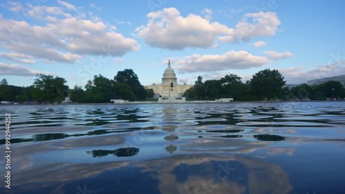 Washington DC politics and democracy concept. US Capitol monument in daylight. Washington DC federal government symbol. Capitol building with clouds. Washington DC iconic landmark.