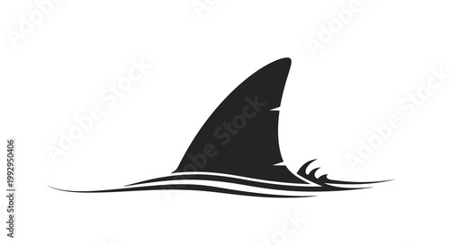 A solitary shark fin breaks the surface of wavy dark water