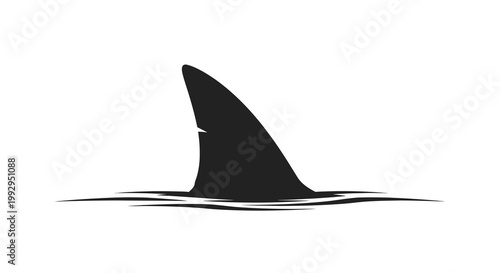 A black shark fin cuts through the water s surface ominously