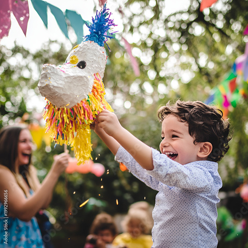 Child celebrating birthday with colorful pinata in backyard party fun and joyful atmosphere candid moment