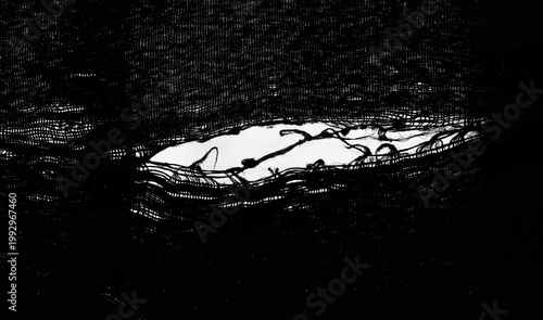 teared rag spread isolated on white background backdrop pattern texture. hole in tissue black fabric torn stitch hole loose threads Torn fabric with frayed edges Mockup mock up mock-up template blank