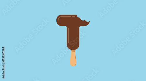 Chocolate-dipped letter T ice cream on a stick with a bite taken out
