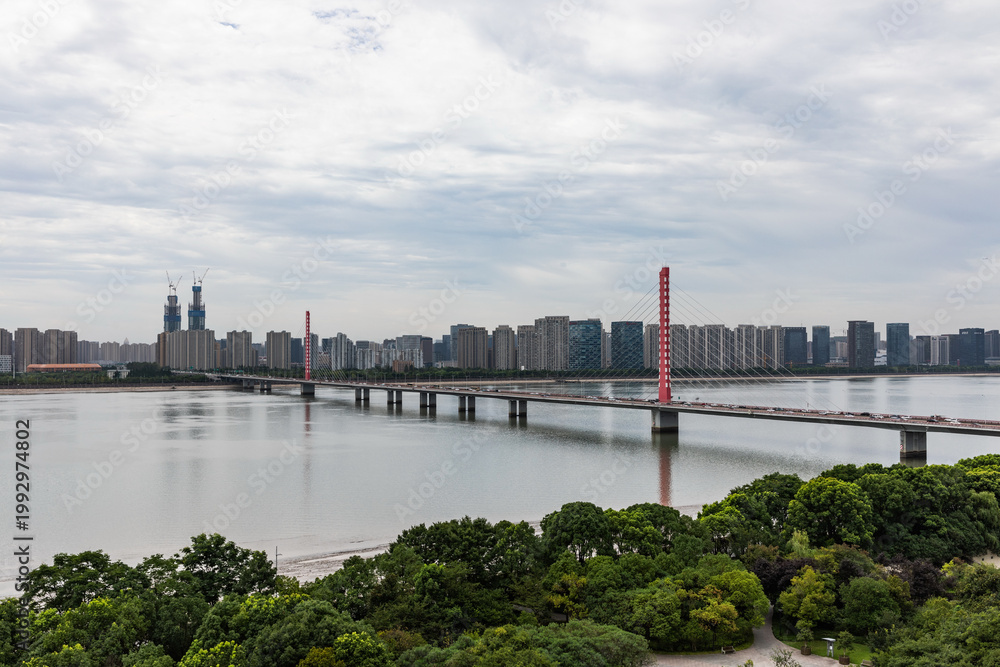 Fototapeta premium Hangzhou Qianjiang Third Bridge and modern skyline over the river