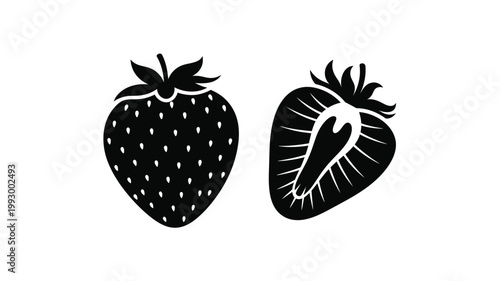 Black silhouettes of strawberries one whole and one sliced silhouette