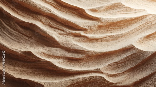 Wavy sand dune texture with natural light shadows and brown hues