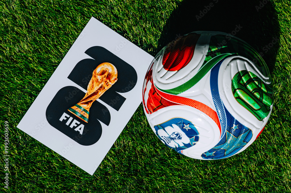 Fototapeta premium Official FIFA World Cup 2026 Match Ball on Pitch and official logo of soccer tournament in USA, Canada and Mexico