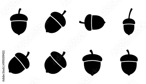 Minimalist acorn silhouette icons, set of 8 black oak nut vector illustrations, autumn forest seed symbols for seasonal branding and nature logos