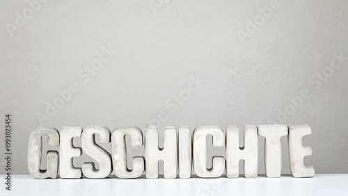 History From German Word GESCHICHTE Concrete Letters Minimal Studio Background